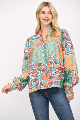 Women wearing a patterned blouse and blue jeans on a white background.