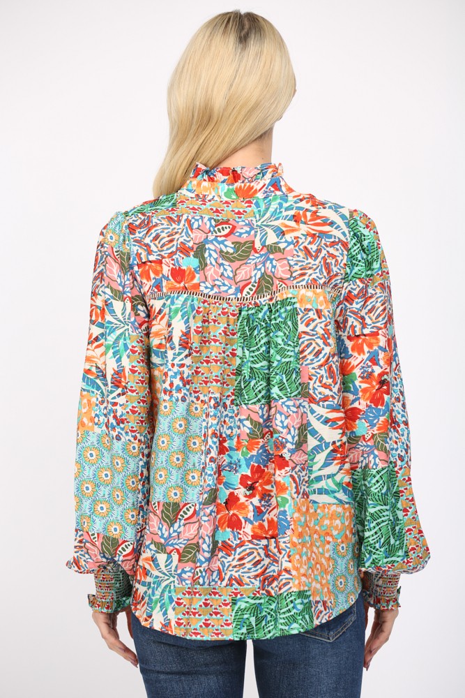 Women wearing a patterned blouse and blue jeans on a white background.