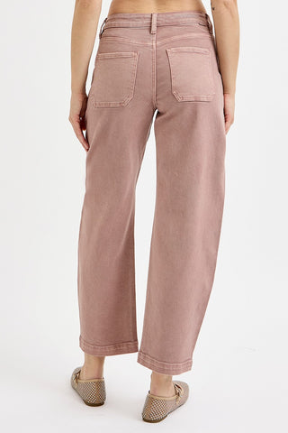 Pink wide-leg pants worn by a person on a white background