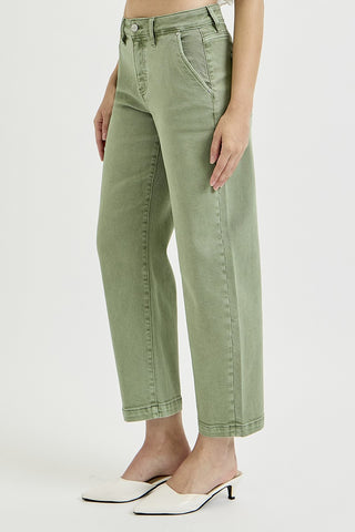 Person wearing green pants on a white background