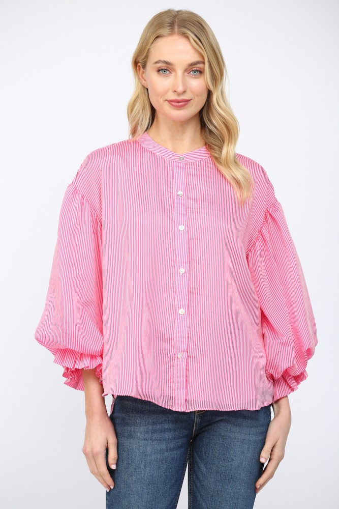 Women wearing a pink striped button up blouse on a white background.