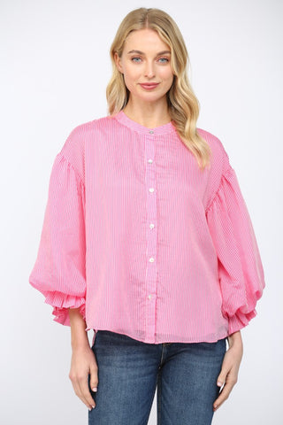 Women wearing a pink striped button up blouse on a white background.