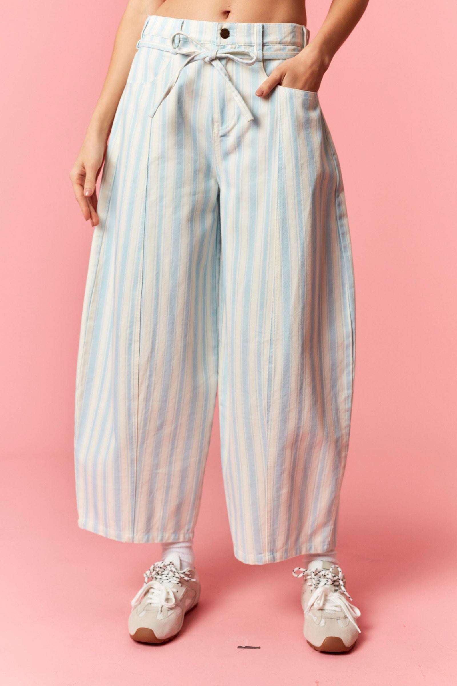 Women wearing a blue and white stripe barrel pants