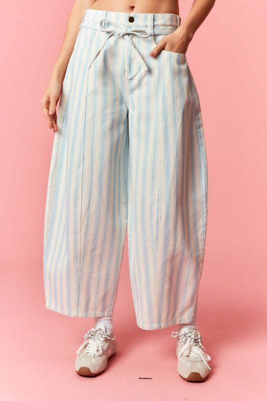 Women wearing a blue and white stripe barrel pants