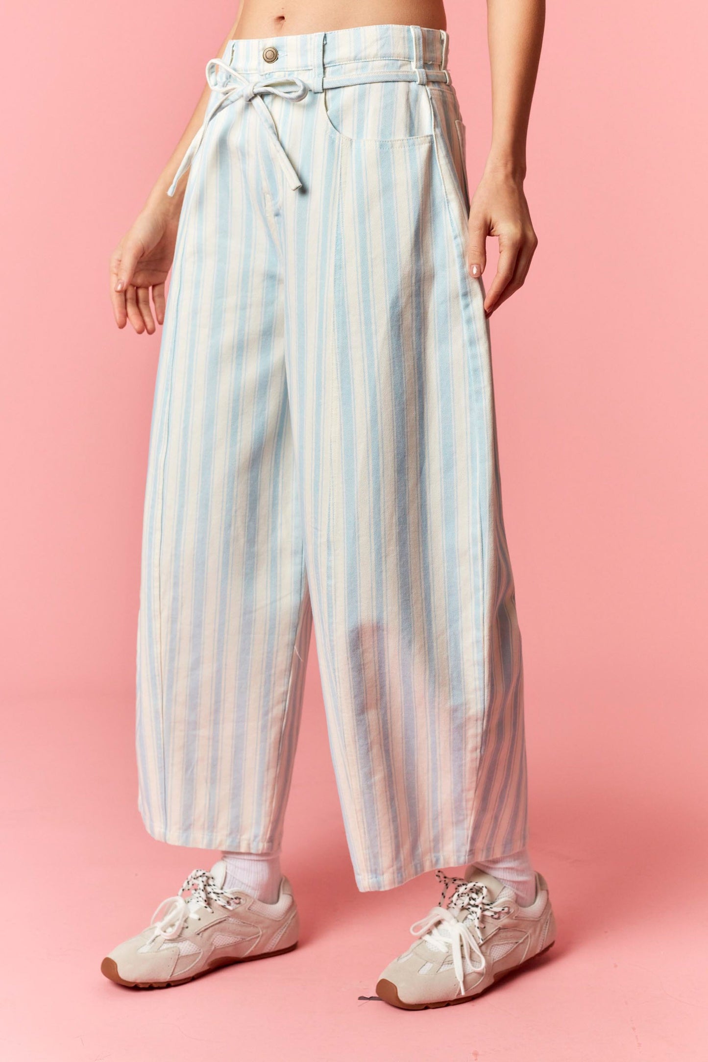 Women wearing a blue and white stripe barrel pants