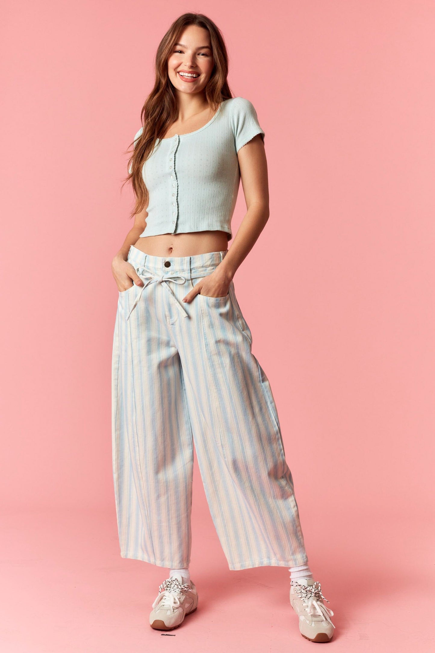 Women wearing a blue and white stripe barrel pants