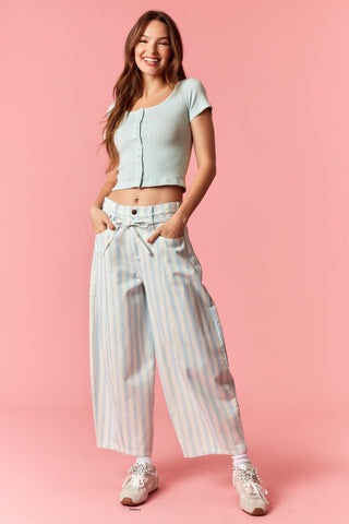Women wearing a blue and white stripe barrel pants