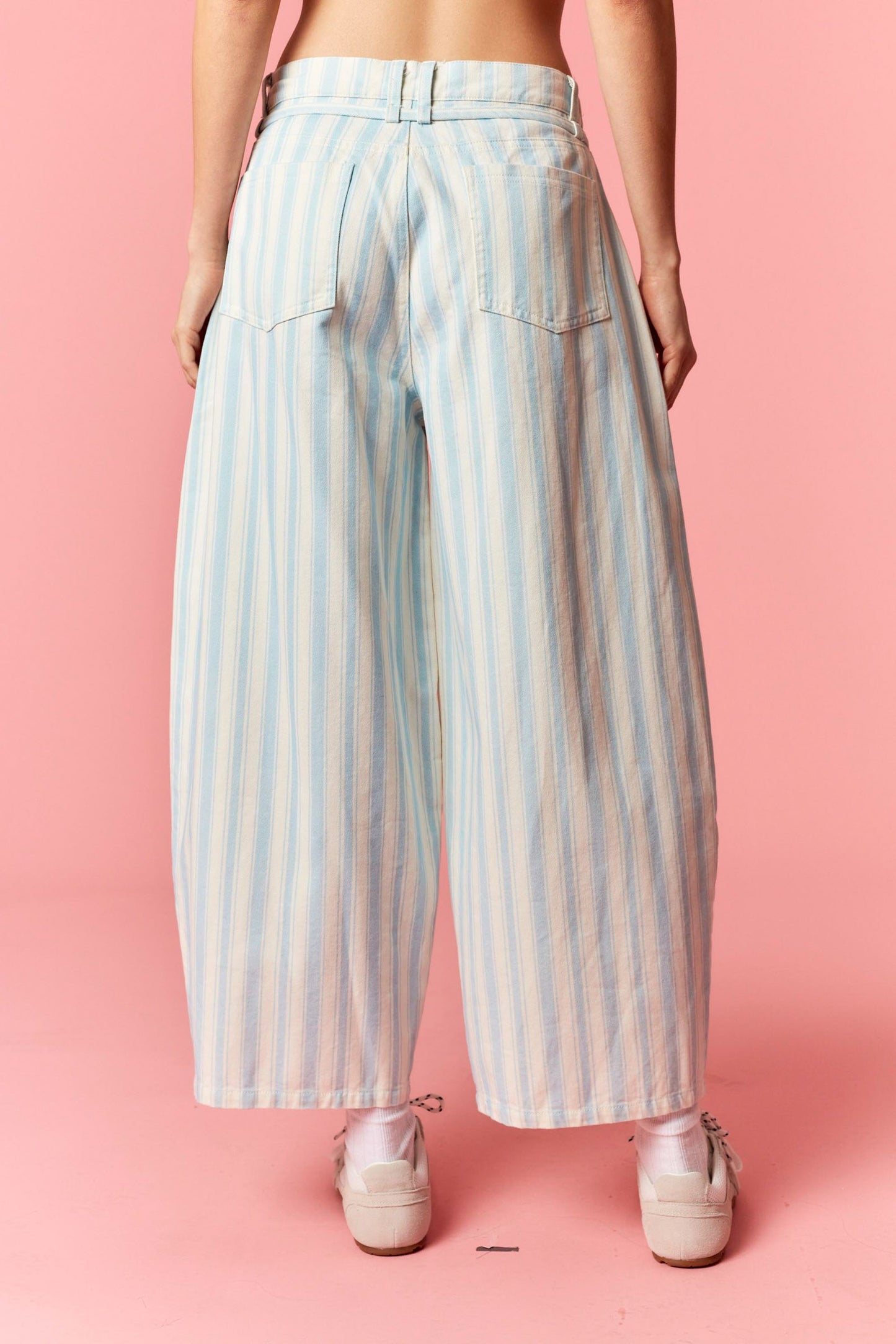 Women wearing a blue and white stripe barrel pants