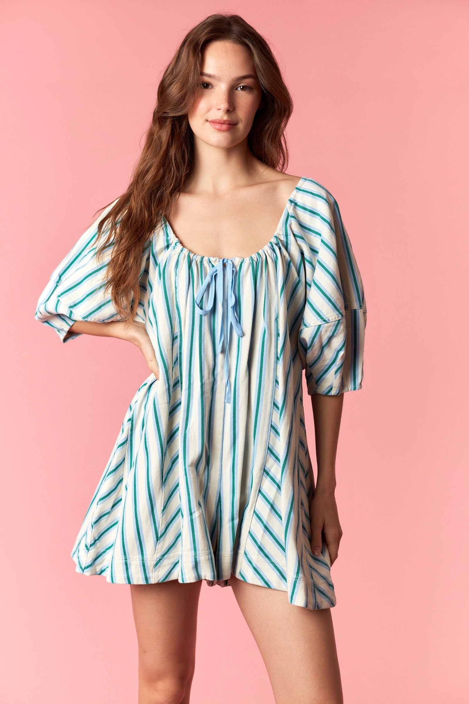 Women wearing a blue and white stripe romper.