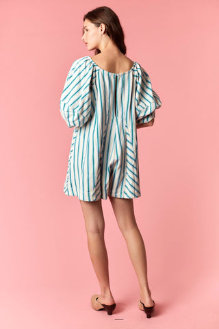 Women wearing a blue and white stripe romper.