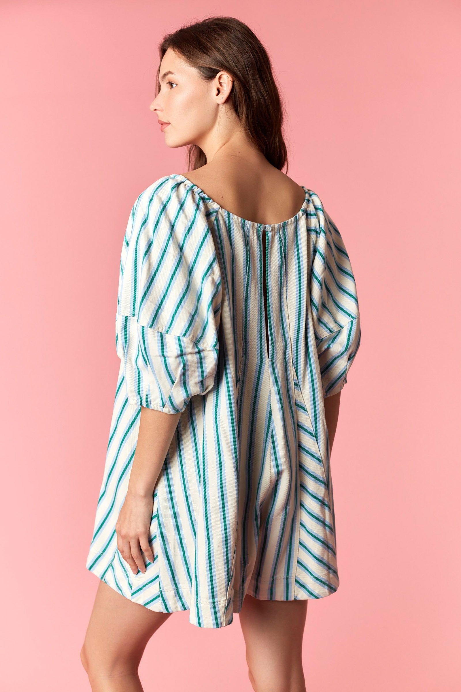 Women wearing a blue and white stripe romper.