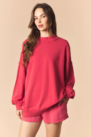 Woman wearing a red outfit on a beige background