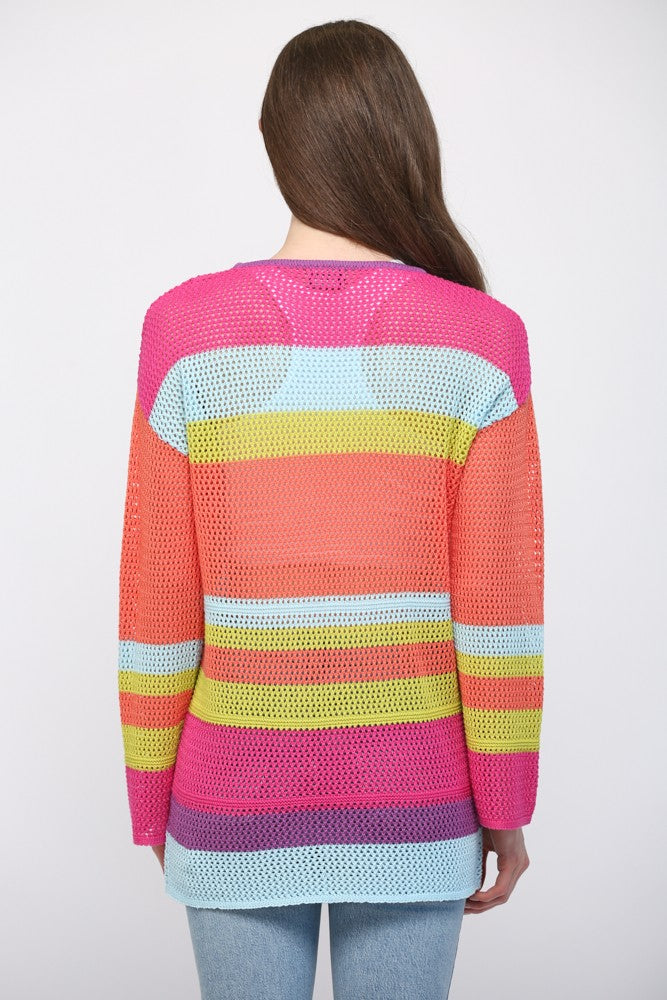 Women wearing a striped bright colour sweater and blue jeans.