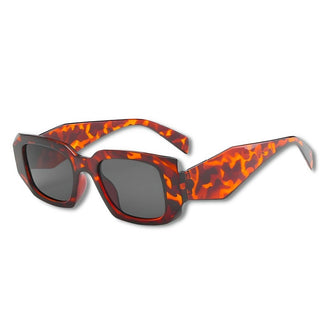 tortoiseshell sunglasses with a plain background