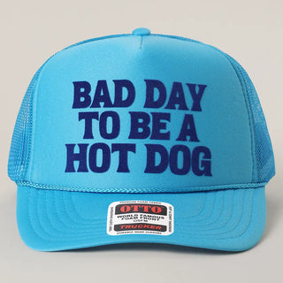 Blue cap with 'Bad Day to be a Hot Dog' text on a gray background