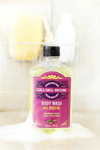 Body wash bottle with pink label on a white background