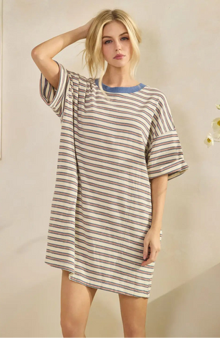 Women wearing a striped t-shirt dress against a neutral background.