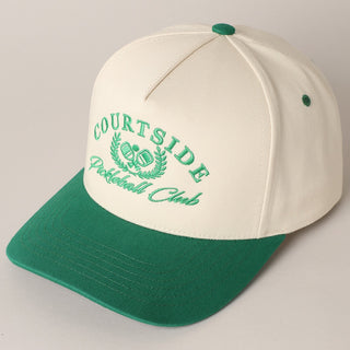 White and green cap with 'Courtside Pickleball Club' text on a light gray background