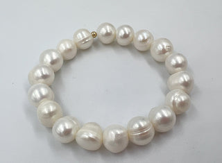 Pearl bracelet on a light gray background
