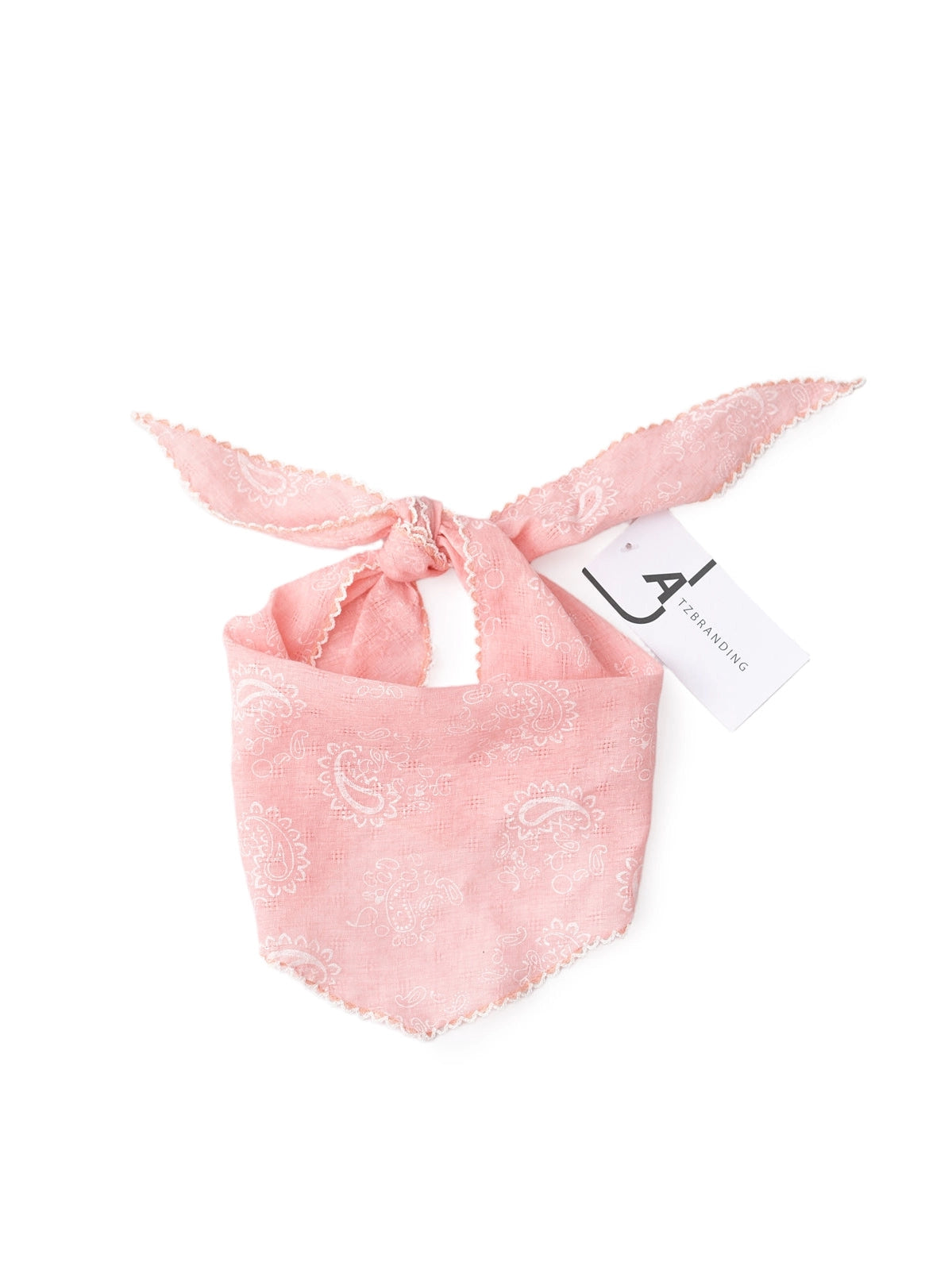 Pink bandana with a brand tag on a white background