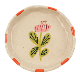 Ceramic plate with floral design on a white background
