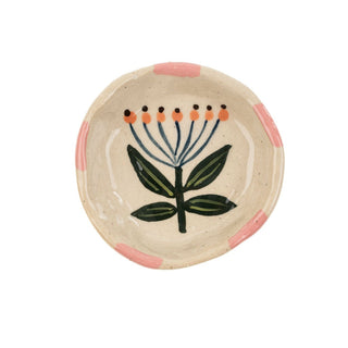 Ceramic dish with floral design on a white background