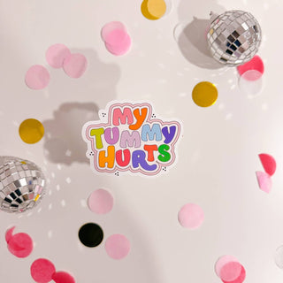 Stickers with a quote 'What a good day to be proud of the progress you've made' on a pink background with confetti and decorative items around.