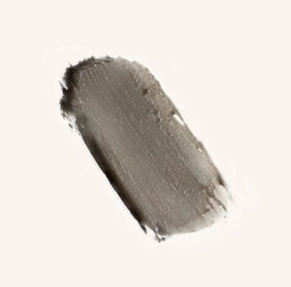 Routine Natural deodorant stick against a neutral background.