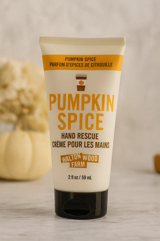 Tube of pumpkin spice hand rescue cream with pumpkins in the background