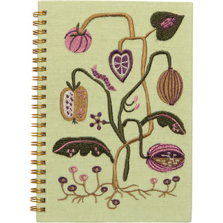 Notebook with embroidered plant design on a light green background