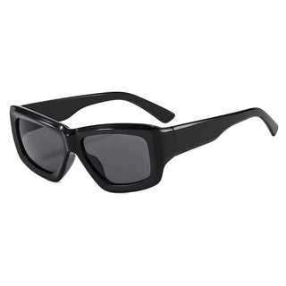 A pair of black, wrap-around style sunglasses with a slightly upturned shape.