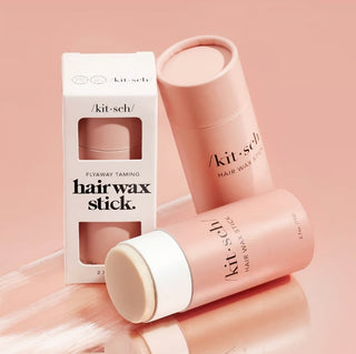 Kit-Sch hair wax stick with packaging on a pink background