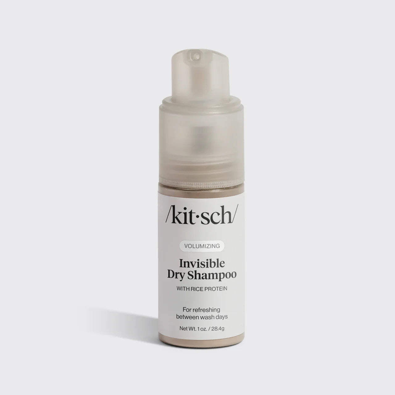Kitsch invisible dry shampoo bottle on a light gray background