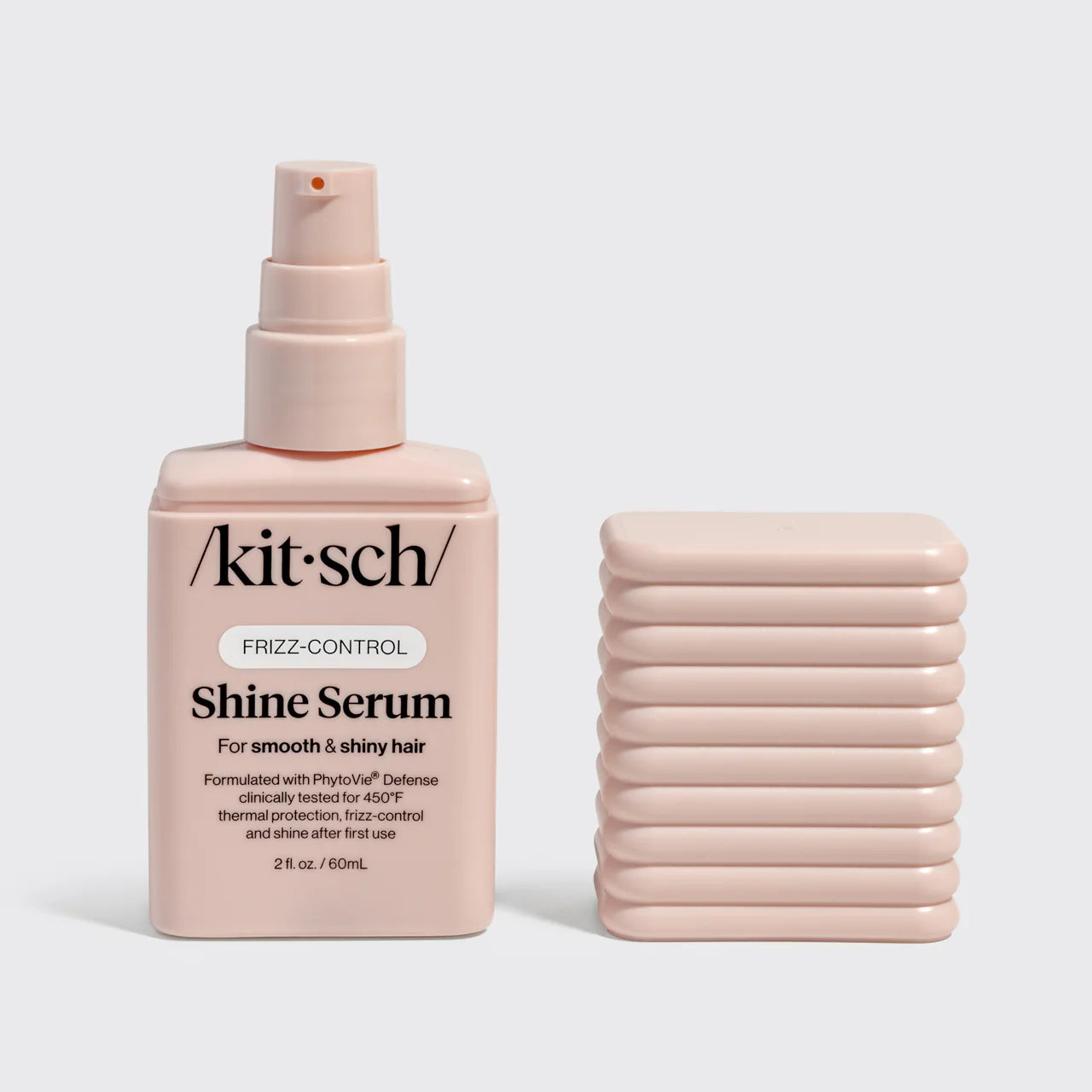 Kit-sch Shine Serum bottle with packaging on a light gray background