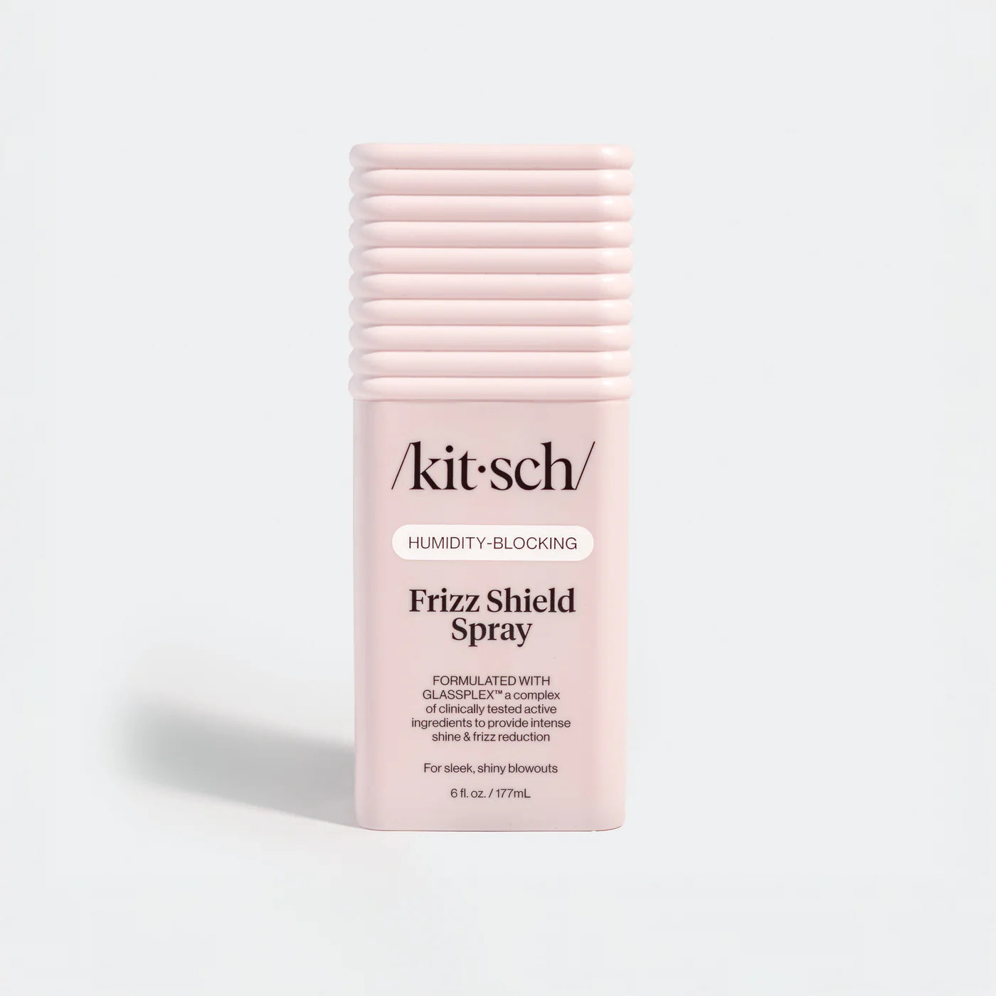 Kit-sch Frizz Shield Spray bottle on a light gray background