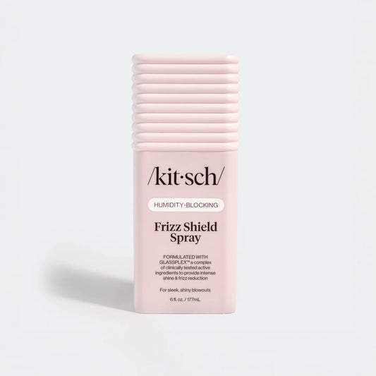 Kit-sch Frizz Shield Spray bottle on a light gray background