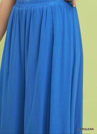 Blue skirt with a green background