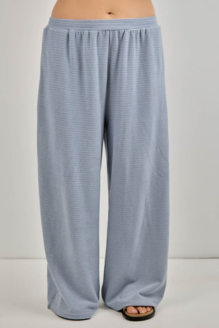 Blue striped pants on a plain background
