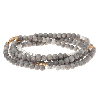a beaded crystal wrap bracelet of necklace on a white background