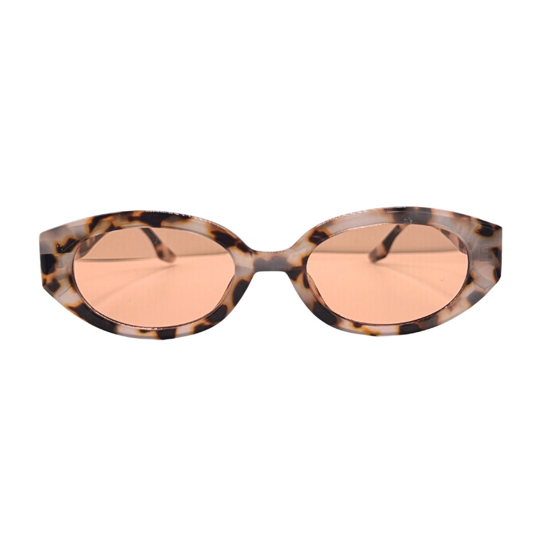 Sunglasses with tortoiseshell frame and rose gold lenses on a white background