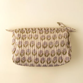 Fabric wall hanging with floral pattern on a beige background