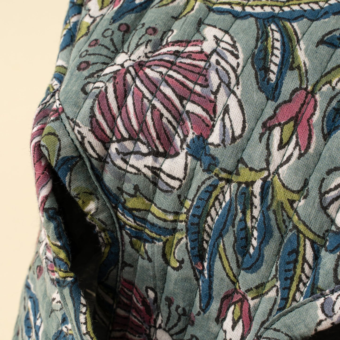 Close-up of a fabric with floral pattern on a beige background