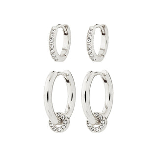 Set of silver hoop earrings with small stones on a white background