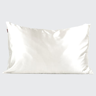 White satin pillowcase on a light gray background