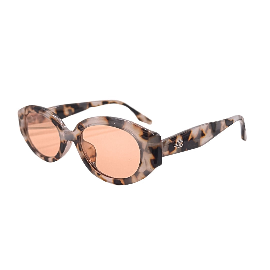 Sunglasses with tortoiseshell frame and rose gold lenses on a white background
