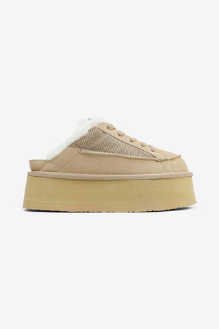 Beige platform sneaker on a white background