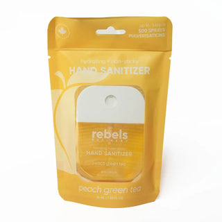 A yellow Rebels Hand Sanitizer pouch in peach green tea flavor, containing a 10 mL hand sanitizer bottle, shown on a white background.