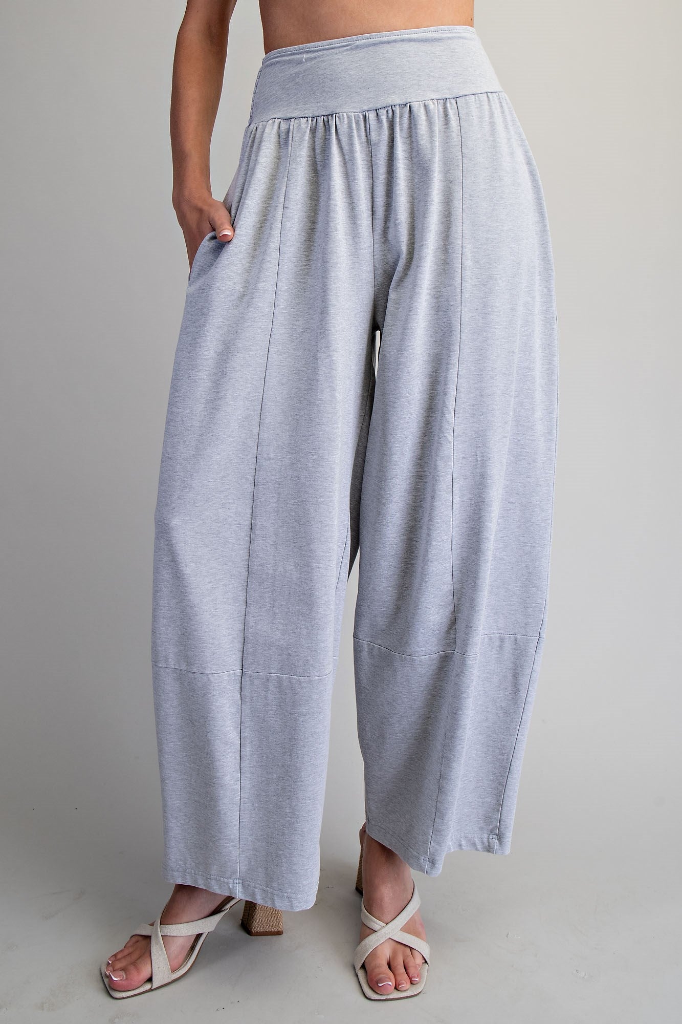 Light gray wide-leg pants worn by a person on a plain background