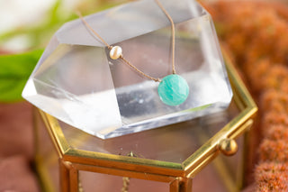 close up on a blue crystal for a necklace