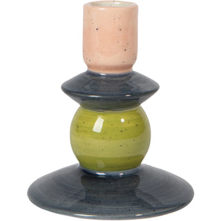 Ceramic candle holder with multicolored design on a white background